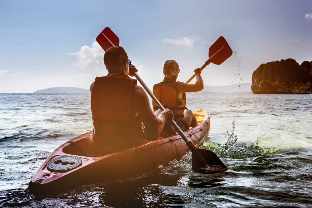 man and woman in a kayak