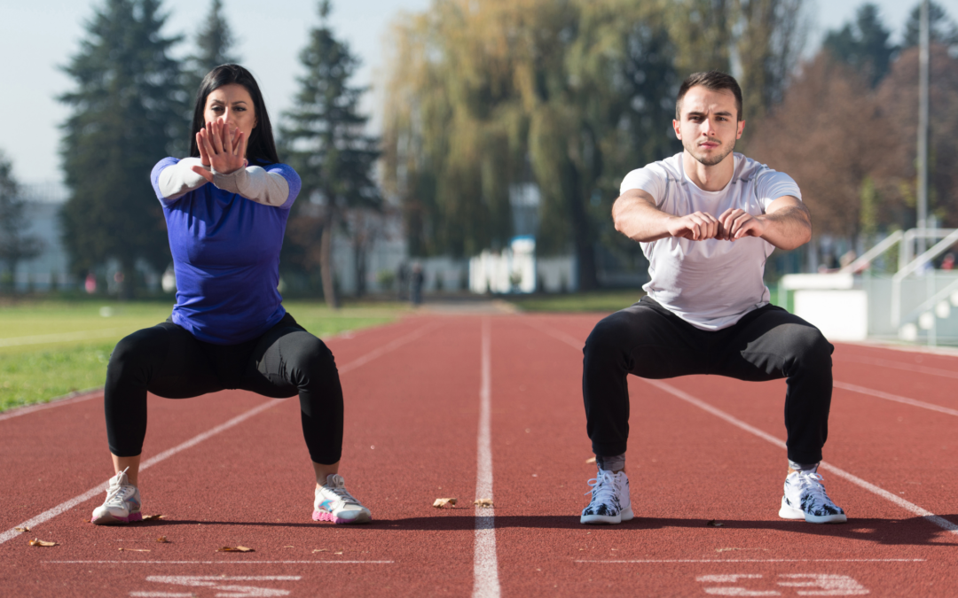 couple exercising outside on track